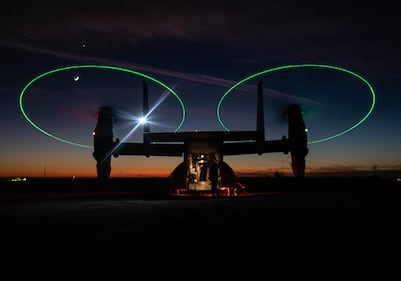 An MV-22 Osprey stages during a night during a Tactical Recovery of Aircraft and Personnel (TRAP) exercise at Marine Corps Base Camp Pendleton, Calif., Dec. 16, 2020.