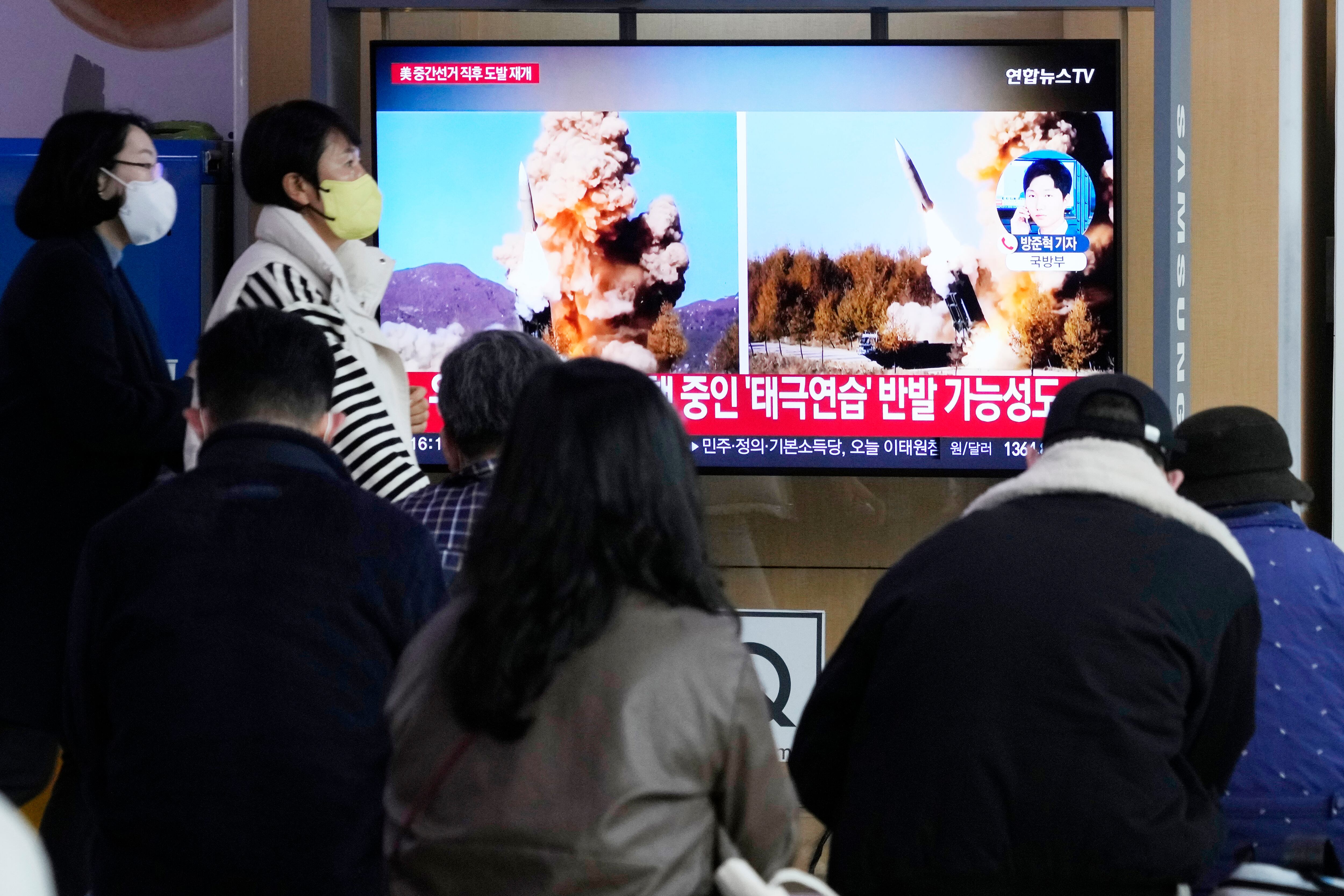 A TV screen shows file images of North Korea's missile launch during a news program at the Seoul Railway Station in Seoul, South Korea, Wednesday, Nov. 9, 2022.