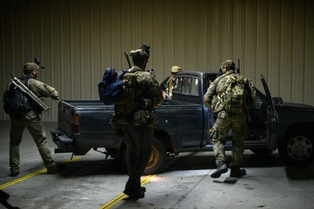 Special Forces candidates check and secure their final "combat target" at Curtis L. Brown, Jr. Field Airport in Elizabethtown, Tuesday, Sept. 29, 2023, during the final phase of field training known as Robin Sage.