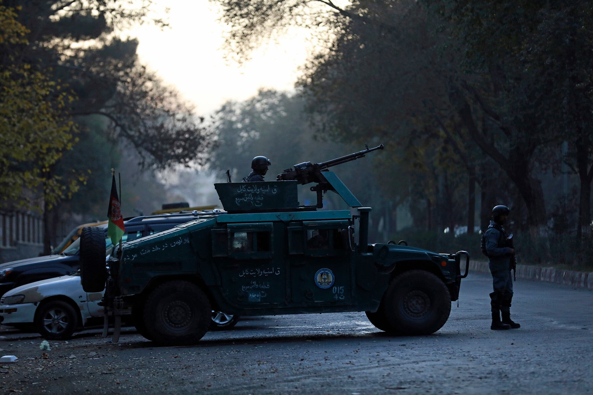 Afghan police patrol at the site of an attack at Kabul University in Kabul, Afghanistan, Monday, Nov. 2, 2020.