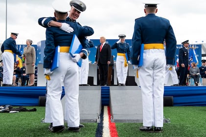 President Donald Trump congratulates cadets at the U.S. Air Force Academy graduation at Falcon Stadium in Colorado Springs, Colo.