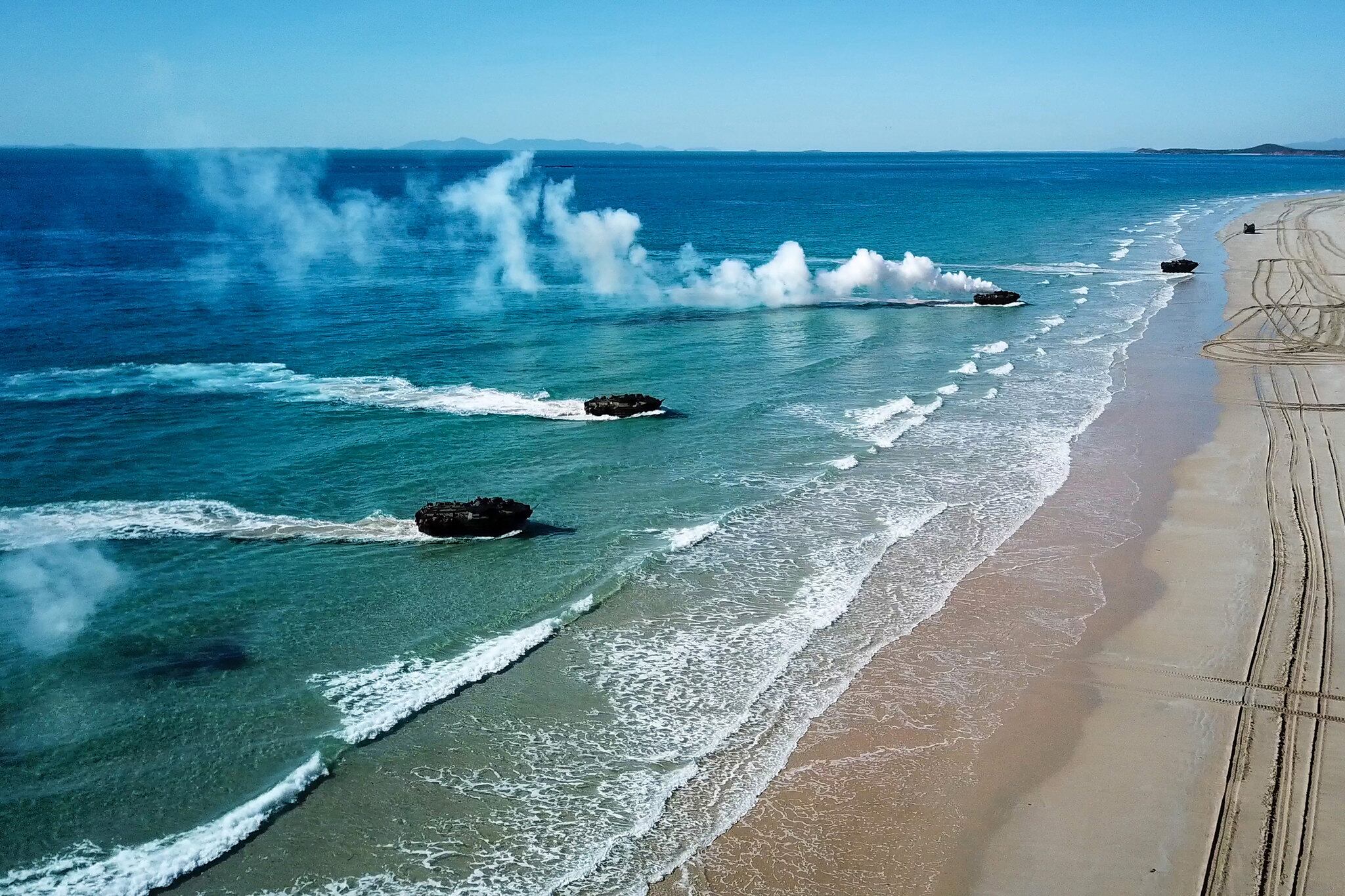 Amphibious assault vehicles approach Langhams Beach in Stanage Bay in Queensland, Australia, during a multinational amphibious landing July 16, 2019, as part of exercise Talisman Sabre 2019.