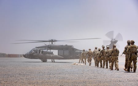 Soldiers from Charlie Company, 4-118 Infantry Regiment, 30th Armored Brigade Combat Team conduct squad assault lanes using aviation support for extraction while deployed in the Central Command area of responsibility for Operation Spartan Shield on May 21, 2020.