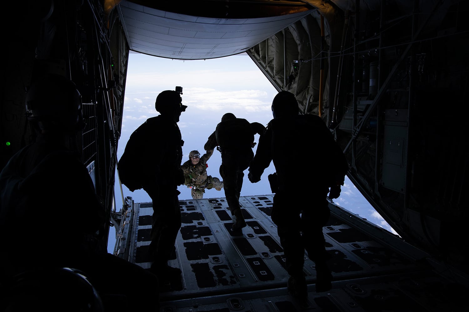 Marines conduct parachute training operations over Marine Corps Air Station Kaneohe Bay, Marine Corps Base Hawaii, July 19, 2019.